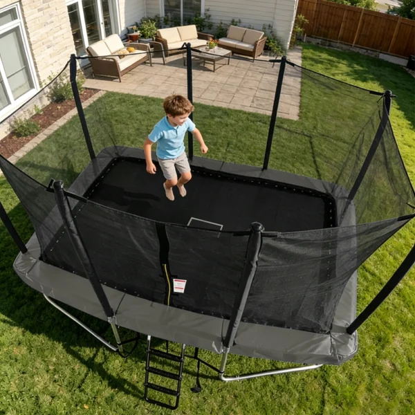 Little Boy Jumping On Large Rectangular Kids Trampoline, Spacious Outdoor Backyard Play Trampoline For Multiple Children